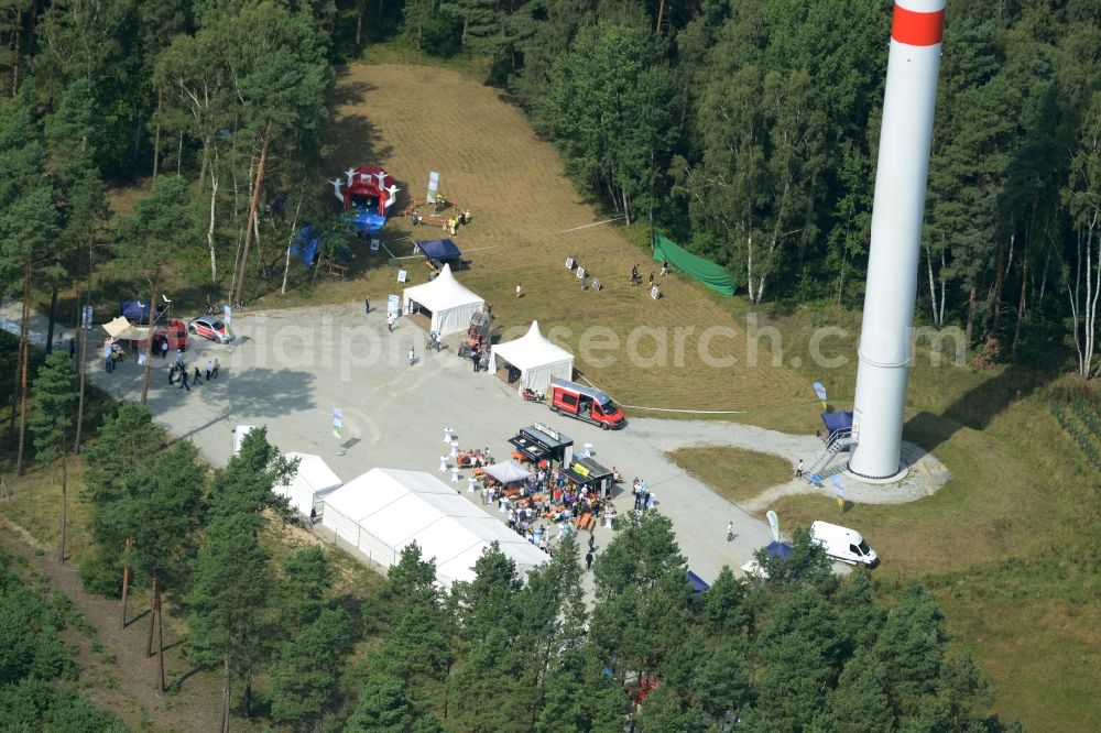 Sallgast from the bird's eye view: Opening party of the forest- windpark Goellnitz-Lieskau-Rehain in Sallgast in the state of Brandenburg. Developed by UKA the largest forest windpark of Germany opens with tents, drinks and stands on the foot of a turbine in a forest