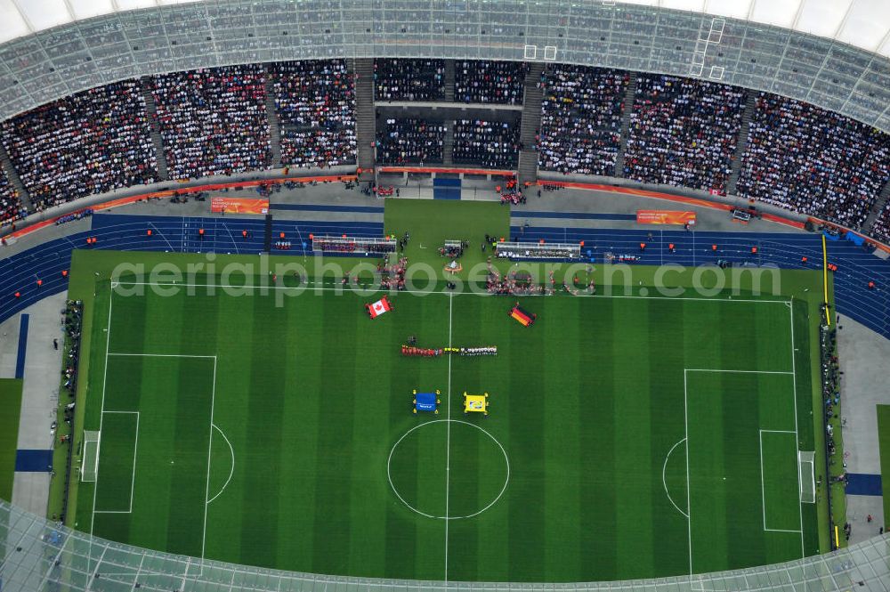 Aerial photograph Berlin - Blick auf das Eröffnungsspiel der Fußball-Weltmeisterschaft der Frauen 2011 im Berliner Olympiastadion. Die deutsche Nationalmannschaft der Frauen trifft auf die Mannschaft Kanadas, Die 6. Fußball-Weltmeisterschaft der Frauen (offiziell: FIFA Women’s World Cup Germany 2011 / „ FIFA Frauen-Weltmeisterschaft Deutschland 2011 “) wird vom 26. Juni bis 17. Juli 2011 im Land des Titelverteidigers Deutschland ausgetragen. Opening match of the FIFA Women's World Cup 2011 in Berlin's Olympic Stadium.