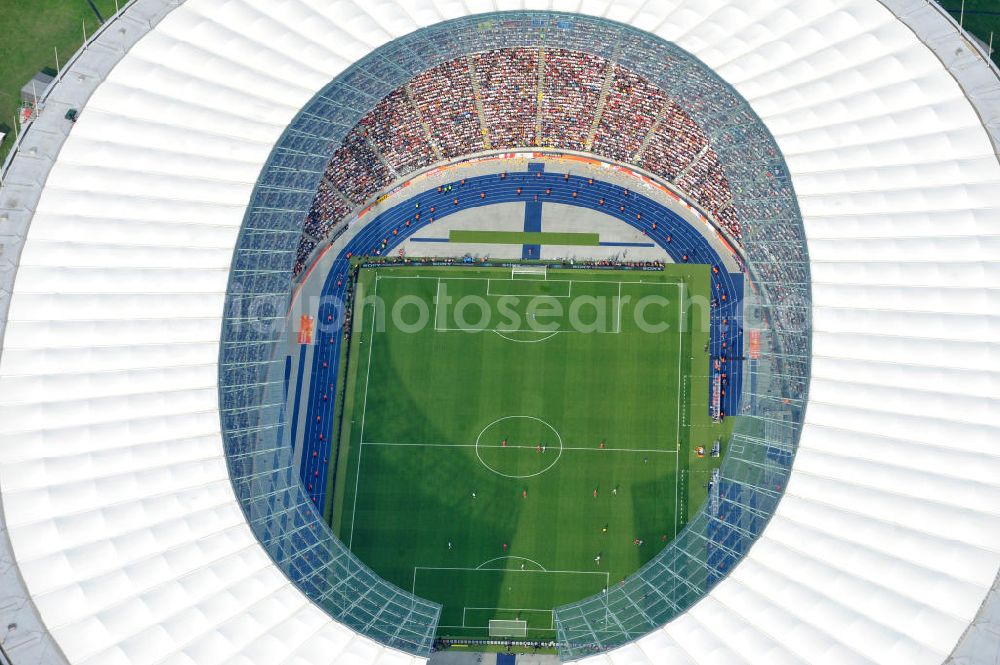 Aerial image Berlin - Blick auf das Eröffnungsspiel der Fußball-Weltmeisterschaft der Frauen 2011 im Berliner Olympiastadion. Die deutsche Nationalmannschaft der Frauen trifft auf die Mannschaft Kanadas, Die 6. Fußball-Weltmeisterschaft der Frauen (offiziell: FIFA Women’s World Cup Germany 2011 / „ FIFA Frauen-Weltmeisterschaft Deutschland 2011 “) wird vom 26. Juni bis 17. Juli 2011 im Land des Titelverteidigers Deutschland ausgetragen. Opening match of the FIFA Women's World Cup 2011 in Berlin's Olympic Stadium.