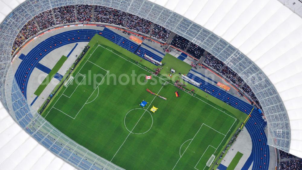 Aerial photograph Berlin - Blick auf das Eröffnungsspiel der Fußball-Weltmeisterschaft der Frauen 2011 im Berliner Olympiastadion. Die deutsche Nationalmannschaft der Frauen trifft auf die Mannschaft Kanadas, Die 6. Fußball-Weltmeisterschaft der Frauen (offiziell: FIFA Women’s World Cup Germany 2011 / „ FIFA Frauen-Weltmeisterschaft Deutschland 2011 “) wird vom 26. Juni bis 17. Juli 2011 im Land des Titelverteidigers Deutschland ausgetragen. Opening match of the FIFA Women's World Cup 2011 in Berlin's Olympic Stadium.