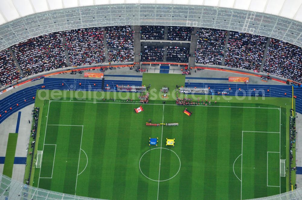 Berlin from the bird's eye view: Blick auf das Eröffnungsspiel der Fußball-Weltmeisterschaft der Frauen 2011 im Berliner Olympiastadion. Die deutsche Nationalmannschaft der Frauen trifft auf die Mannschaft Kanadas, Die 6. Fußball-Weltmeisterschaft der Frauen (offiziell: FIFA Women’s World Cup Germany 2011 / „ FIFA Frauen-Weltmeisterschaft Deutschland 2011 “) wird vom 26. Juni bis 17. Juli 2011 im Land des Titelverteidigers Deutschland ausgetragen. Opening match of the FIFA Women's World Cup 2011 in Berlin's Olympic Stadium.