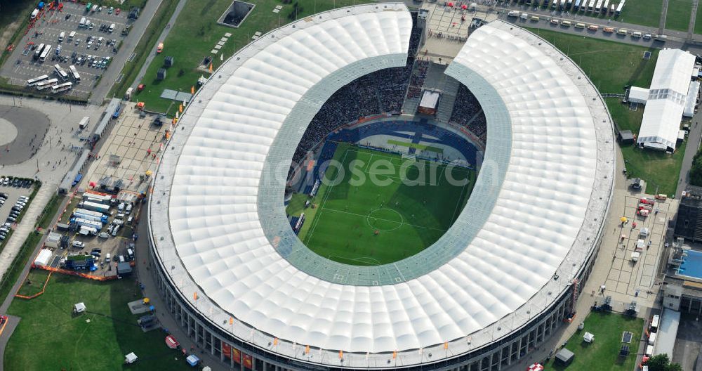 Aerial photograph Berlin - Blick auf das Eröffnungsspiel der Fußball-Weltmeisterschaft der Frauen 2011 im Berliner Olympiastadion. Die deutsche Nationalmannschaft der Frauen trifft auf die Mannschaft Kanadas, Die 6. Fußball-Weltmeisterschaft der Frauen (offiziell: FIFA Women’s World Cup Germany 2011 / „ FIFA Frauen-Weltmeisterschaft Deutschland 2011 “) wird vom 26. Juni bis 17. Juli 2011 im Land des Titelverteidigers Deutschland ausgetragen. Opening match of the FIFA Women's World Cup 2011 in Berlin's Olympic Stadium.