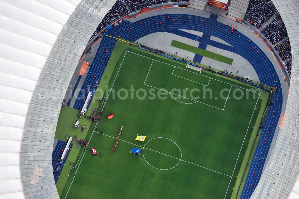 Aerial photograph Berlin - Blick auf das Eröffnungsspiel der Fußball-Weltmeisterschaft der Frauen 2011 im Berliner Olympiastadion. Die deutsche Nationalmannschaft der Frauen trifft auf die Mannschaft Kanadas, Die 6. Fußball-Weltmeisterschaft der Frauen (offiziell: FIFA Women’s World Cup Germany 2011 / „ FIFA Frauen-Weltmeisterschaft Deutschland 2011 “) wird vom 26. Juni bis 17. Juli 2011 im Land des Titelverteidigers Deutschland ausgetragen. Opening match of the FIFA Women's World Cup 2011 in Berlin's Olympic Stadium.