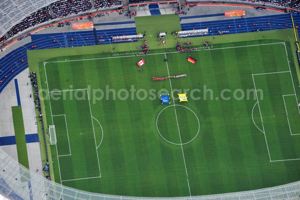 Berlin from above - Blick auf das Eröffnungsspiel der Fußball-Weltmeisterschaft der Frauen 2011 im Berliner Olympiastadion. Die deutsche Nationalmannschaft der Frauen trifft auf die Mannschaft Kanadas, Die 6. Fußball-Weltmeisterschaft der Frauen (offiziell: FIFA Women’s World Cup Germany 2011 / „ FIFA Frauen-Weltmeisterschaft Deutschland 2011 “) wird vom 26. Juni bis 17. Juli 2011 im Land des Titelverteidigers Deutschland ausgetragen. Opening match of the FIFA Women's World Cup 2011 in Berlin's Olympic Stadium.