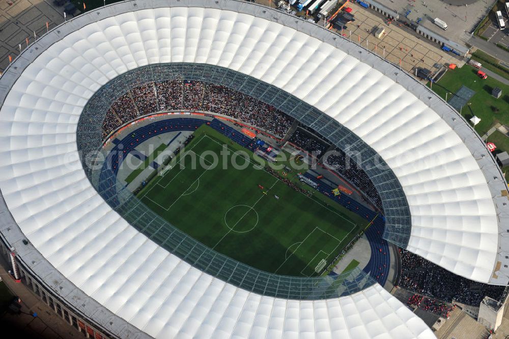 Aerial image Berlin - Blick auf das Eröffnungsspiel der Fußball-Weltmeisterschaft der Frauen 2011 im Berliner Olympiastadion. Die deutsche Nationalmannschaft der Frauen trifft auf die Mannschaft Kanadas, Die 6. Fußball-Weltmeisterschaft der Frauen (offiziell: FIFA Women’s World Cup Germany 2011 / „ FIFA Frauen-Weltmeisterschaft Deutschland 2011 “) wird vom 26. Juni bis 17. Juli 2011 im Land des Titelverteidigers Deutschland ausgetragen. Opening match of the FIFA Women's World Cup 2011 in Berlin's Olympic Stadium.