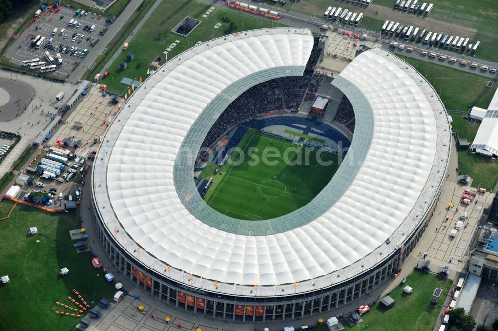 Aerial photograph Berlin - Blick auf das Eröffnungsspiel der Fußball-Weltmeisterschaft der Frauen 2011 im Berliner Olympiastadion. Die deutsche Nationalmannschaft der Frauen trifft auf die Mannschaft Kanadas, Die 6. Fußball-Weltmeisterschaft der Frauen (offiziell: FIFA Women’s World Cup Germany 2011 / „ FIFA Frauen-Weltmeisterschaft Deutschland 2011 “) wird vom 26. Juni bis 17. Juli 2011 im Land des Titelverteidigers Deutschland ausgetragen. Opening match of the FIFA Women's World Cup 2011 in Berlin's Olympic Stadium.