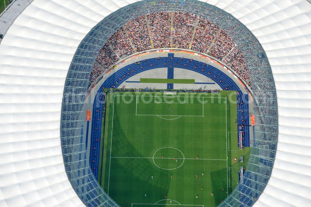 Aerial image Berlin - Blick auf das Eröffnungsspiel der Fußball-Weltmeisterschaft der Frauen 2011 im Berliner Olympiastadion. Die deutsche Nationalmannschaft der Frauen trifft auf die Mannschaft Kanadas, Die 6. Fußball-Weltmeisterschaft der Frauen (offiziell: FIFA Women’s World Cup Germany 2011 / „ FIFA Frauen-Weltmeisterschaft Deutschland 2011 “) wird vom 26. Juni bis 17. Juli 2011 im Land des Titelverteidigers Deutschland ausgetragen. Opening match of the FIFA Women's World Cup 2011 in Berlin's Olympic Stadium.