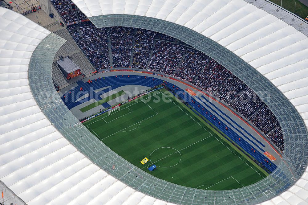 Aerial image Berlin - Blick auf das Eröffnungsspiel der Fußball-Weltmeisterschaft der Frauen 2011 im Berliner Olympiastadion. Die deutsche Nationalmannschaft der Frauen trifft auf die Mannschaft Kanadas, Die 6. Fußball-Weltmeisterschaft der Frauen (offiziell: FIFA Women’s World Cup Germany 2011 / „ FIFA Frauen-Weltmeisterschaft Deutschland 2011 “) wird vom 26. Juni bis 17. Juli 2011 im Land des Titelverteidigers Deutschland ausgetragen. Opening match of the FIFA Women's World Cup 2011 in Berlin's Olympic Stadium.