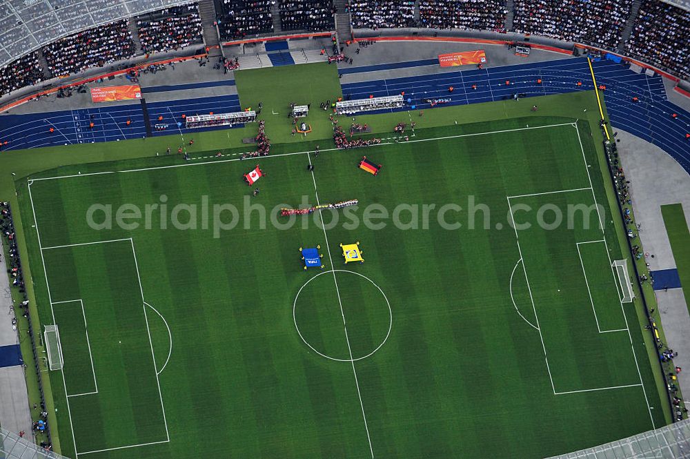 Aerial photograph Berlin - Blick auf das Eröffnungsspiel der Fußball-Weltmeisterschaft der Frauen 2011 im Berliner Olympiastadion. Die deutsche Nationalmannschaft der Frauen trifft auf die Mannschaft Kanadas, Die 6. Fußball-Weltmeisterschaft der Frauen (offiziell: FIFA Women’s World Cup Germany 2011 / „ FIFA Frauen-Weltmeisterschaft Deutschland 2011 “) wird vom 26. Juni bis 17. Juli 2011 im Land des Titelverteidigers Deutschland ausgetragen. Opening match of the FIFA Women's World Cup 2011 in Berlin's Olympic Stadium.