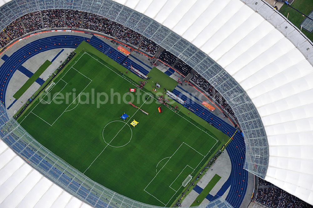 Berlin from the bird's eye view: Blick auf das Eröffnungsspiel der Fußball-Weltmeisterschaft der Frauen 2011 im Berliner Olympiastadion. Die deutsche Nationalmannschaft der Frauen trifft auf die Mannschaft Kanadas, Die 6. Fußball-Weltmeisterschaft der Frauen (offiziell: FIFA Women’s World Cup Germany 2011 / „ FIFA Frauen-Weltmeisterschaft Deutschland 2011 “) wird vom 26. Juni bis 17. Juli 2011 im Land des Titelverteidigers Deutschland ausgetragen. Opening match of the FIFA Women's World Cup 2011 in Berlin's Olympic Stadium.