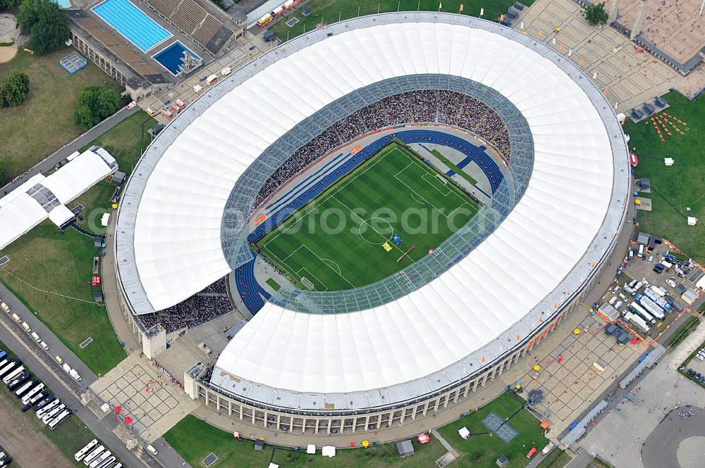 Aerial image Berlin - Blick auf das Eröffnungsspiel der Fußball-Weltmeisterschaft der Frauen 2011 im Berliner Olympiastadion. Die deutsche Nationalmannschaft der Frauen trifft auf die Mannschaft Kanadas, Die 6. Fußball-Weltmeisterschaft der Frauen (offiziell: FIFA Women’s World Cup Germany 2011 / „ FIFA Frauen-Weltmeisterschaft Deutschland 2011 “) wird vom 26. Juni bis 17. Juli 2011 im Land des Titelverteidigers Deutschland ausgetragen. Opening match of the FIFA Women's World Cup 2011 in Berlin's Olympic Stadium.