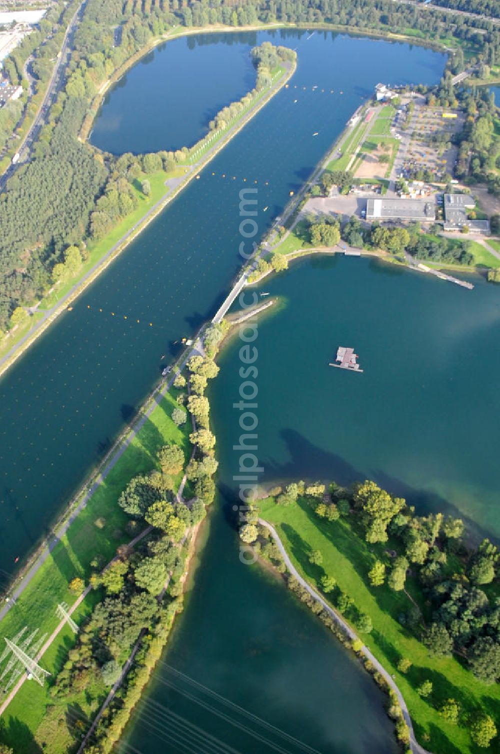 Aerial photograph Köln - Die Regattabahn in der Sport- und Erholungsanlage Fühlinger See an der Industriestraße, der Neusser Landstraße, der Merianstraße und der Oranjehofstraße in Köln-Fühlingen in Nordrhein-Westfalen. The regatta course in the sports ground and recreation park of the lake Fühlinger See at the streets Industriestrasse, der Neusser Landstrasse, der Merianstrasse und der Oranjehofstrasse in Cologne in North Rhine-Westphalia.