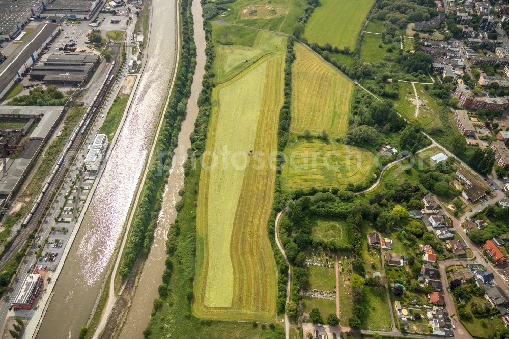 Hamm from above - Harvest use of heavy agricultural machinery - combine harvesters and harvesting vehicles on agricultural fields in Hamm in the state North Rhine-Westphalia, Germany