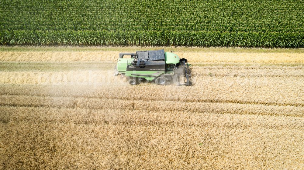 Recklinghausen from the bird's eye view: Harvest use of heavy agricultural machinery - combine harvesters and harvesting vehicles on agricultural fields on street Bergstrasse in the district Suderwich in Recklinghausen at Ruhrgebiet in the state North Rhine-Westphalia, Germany