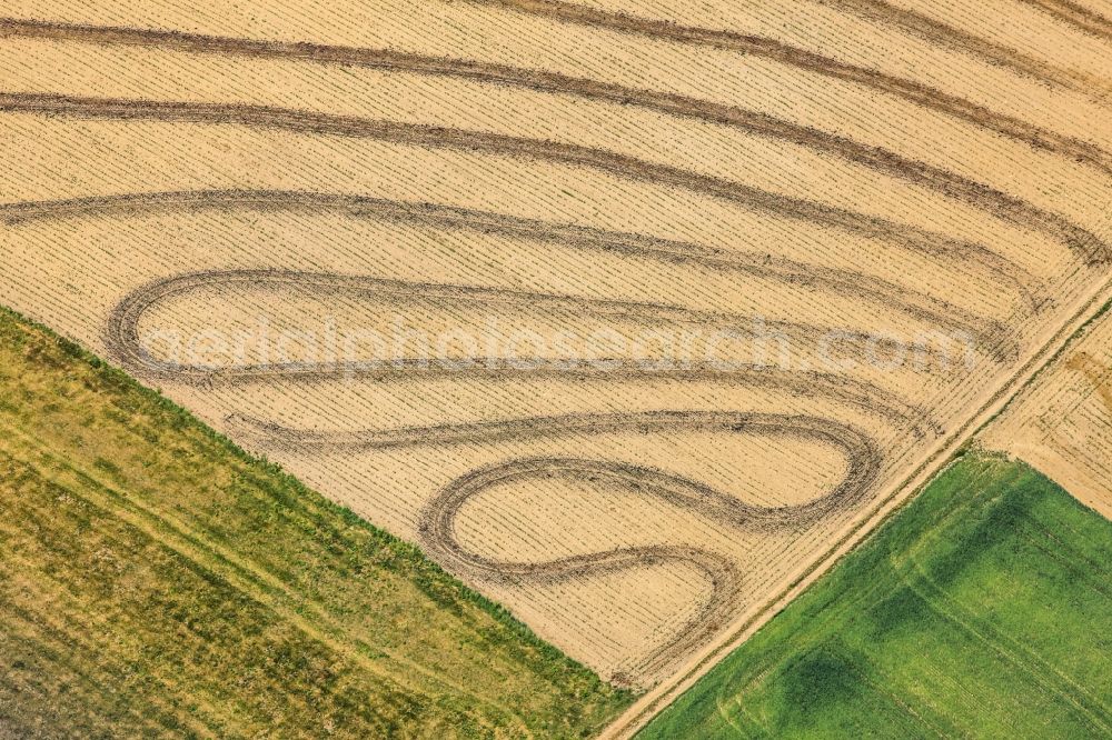 Rattiszell from the bird's eye view: Harvest machine-vehicle tracks on a grain field in Rattiszell in Bavaria