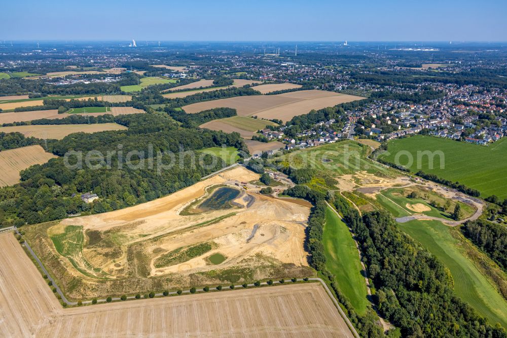 Holte from the bird's eye view: Construction site with development, priming, earthwork and embankment work for the construction of a new golf park on the Noerenbergstrasse in Holtein the state North Rhine-Westphalia, Germany