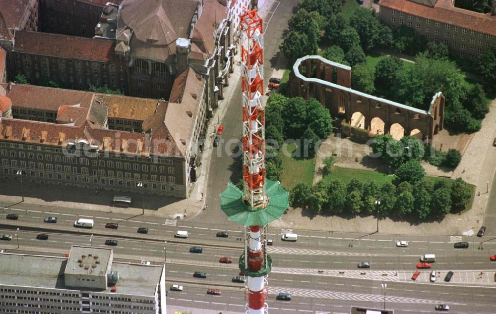 Berlin from the bird's eye view: Extension construction site to raise the steel mast antenna support above the shiny silver sphere of the telecommunications tower building and television tower in Mitte in Berlin, Germany