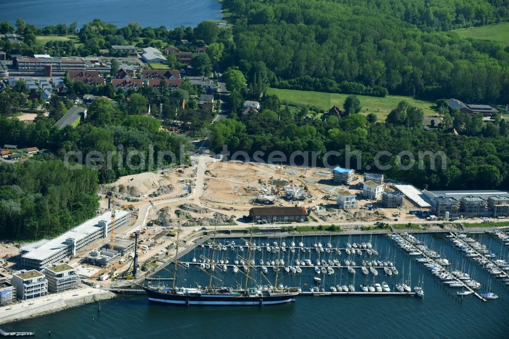 Travemünde from the bird's eye view: The Priwall harbour in the Travemuende part of Luebeck in the state of Schleswig-Holstein. The harbour is located at the river Trave on the mouth to the Baltic Sea. The harbour is on the Eastern riverbank on the peninsula of Priwall. It is primarily a yacht port, also used for sailing ships and ferries