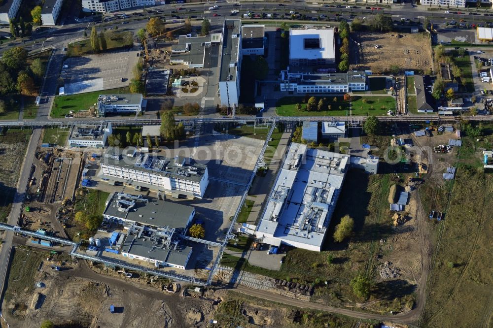 Berlin from above - Expansion construction site on the grounds of the Berlin Chemie AG in Adlershof. The Berlin-based pharmaceutical company is part of the pharmaceutical company Menarini