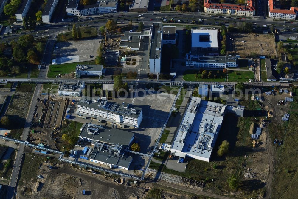 Berlin from the bird's eye view: Expansion construction site on the grounds of the Berlin Chemie AG in Adlershof. The Berlin-based pharmaceutical company is part of the pharmaceutical company Menarini