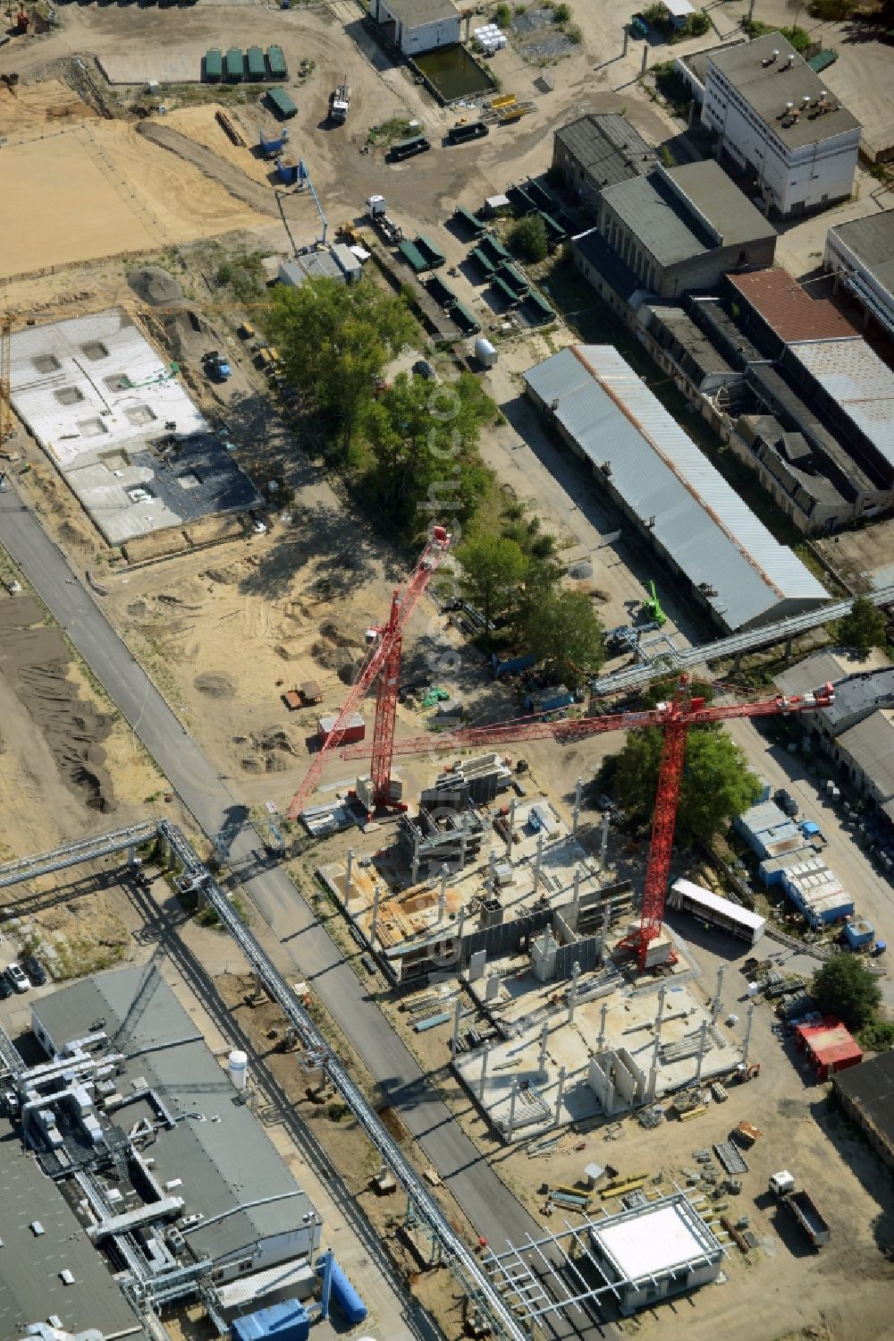 Berlin from above - Expansion construction site on the grounds of the Berlin Chemie AG in Adlershof. The Berlin-based pharmaceutical company is part of the pharmaceutical company Menarini