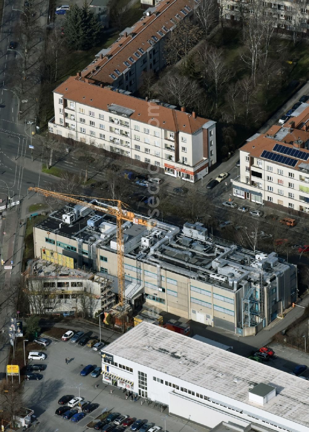 Aerial photograph Berlin - Expansion construction site on the grounds of the Berlin Chemie AG in Neukoelln. The Berlin-based pharmaceutical company is part of the pharmaceutical company Menarini