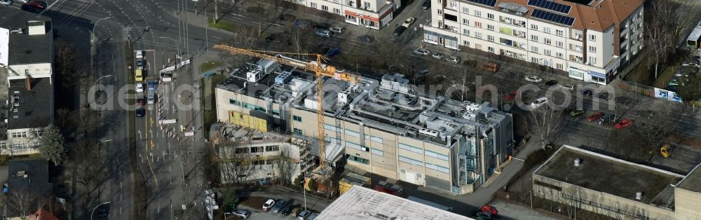 Berlin from the bird's eye view: Expansion construction site on the grounds of the Berlin Chemie AG in Neukoelln. The Berlin-based pharmaceutical company is part of the pharmaceutical company Menarini