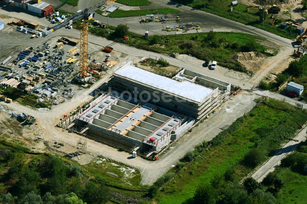 Aerial image Münchehofe - Construction site for the new construction of a flocculation filtration for the expansion of the sewage treatment plant basin and cleaning stages for the waste water treatment of the Berliner Wasserbetriebe on Dahlwitzer Landstrasse in Muenchehofe in the state Brandenburg, Germany