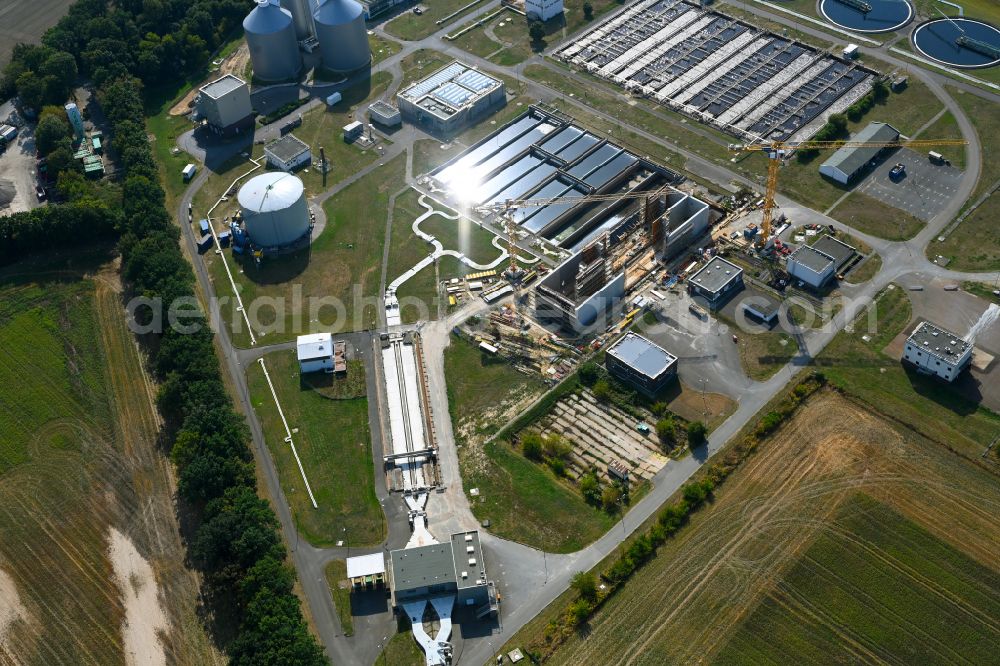 Münchehofe from the bird's eye view: New construction site and extension of the sewage treatment basins and purification stages by building a new flocculation filtration system on street Dahlwitzer Landstrasse in Muenchehofe in the state Brandenburg, Germany