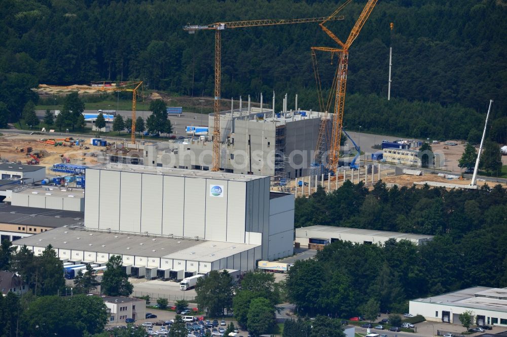 Zeven from the bird's eye view: Expansion construction site to build a new high-bay warehouse and cold store of the DMK Deutsches Milch Kontor GmbH in Zeven in Lower Saxony