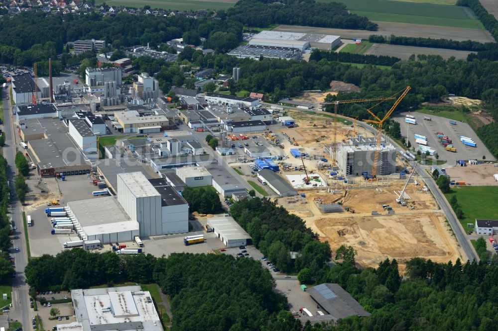 Aerial photograph Zeven - Expansion construction site to build a new high-bay warehouse and cold store of the DMK Deutsches Milch Kontor GmbH in Zeven in Lower Saxony