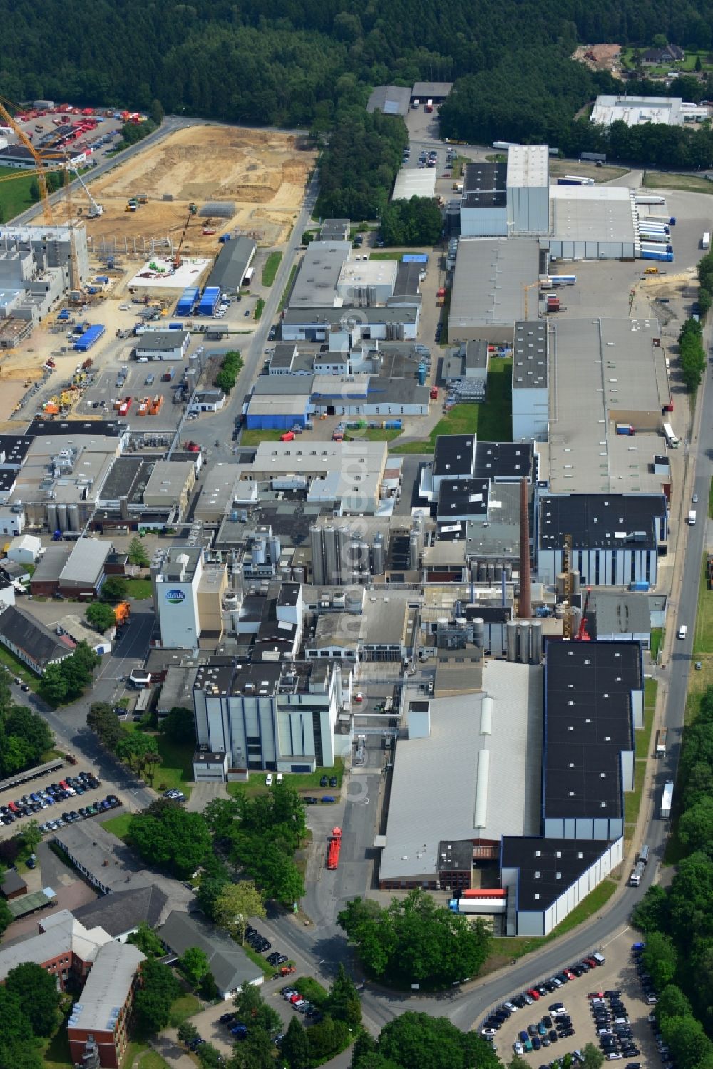 Zeven from the bird's eye view: Expansion construction site to build a new high-bay warehouse and cold store of the DMK Deutsches Milch Kontor GmbH in Zeven in Lower Saxony