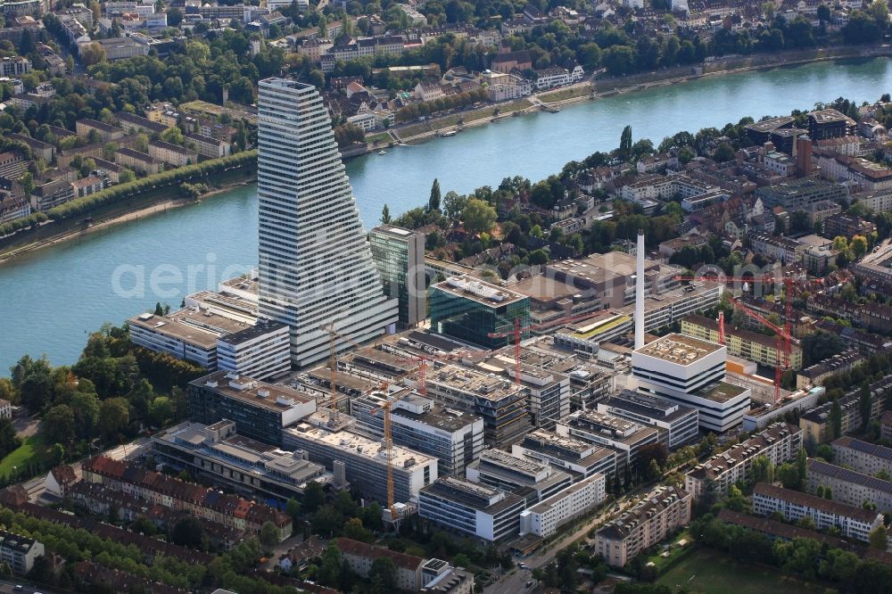 Aerial image Basel - Extension construction sites on the premises and premises of the pharmaceutical company Roche with the cityscape-defining high-rise in Basel in Switzerland