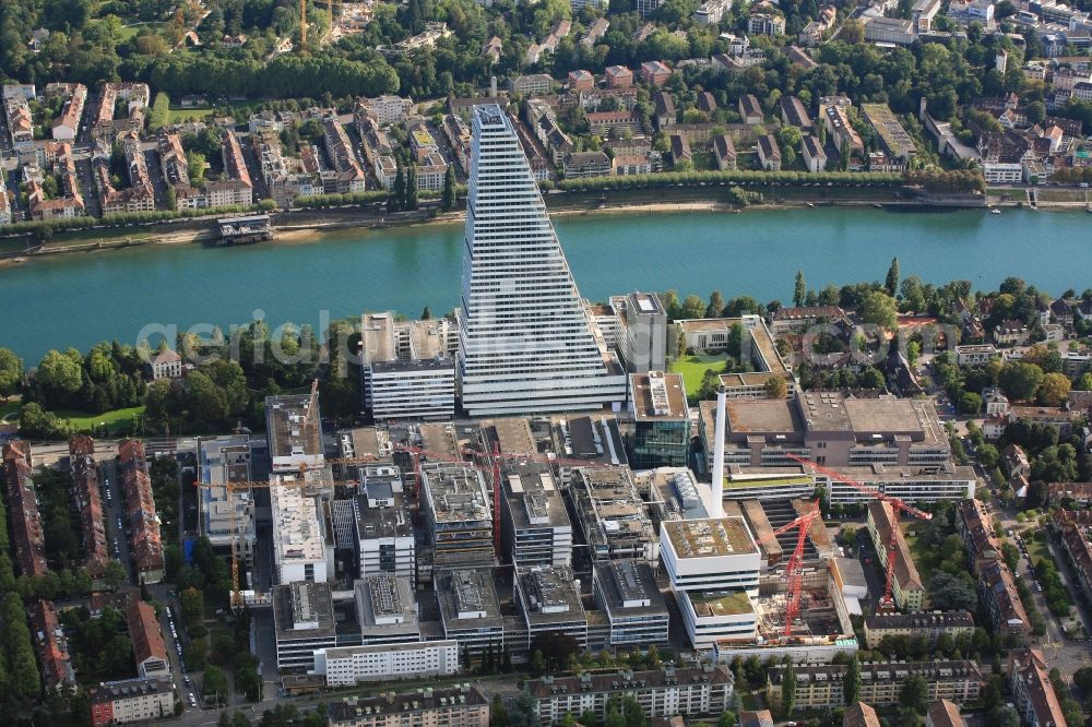 Aerial photograph Basel - Extension construction sites on the premises and premises of the pharmaceutical company Roche with the cityscape-defining high-rise in Basel in Switzerland