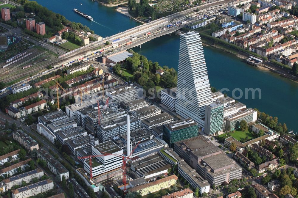 Basel from above - Extension construction sites on the premises and premises of the pharmaceutical company Roche with the cityscape-defining high-rise in Basel in Switzerland