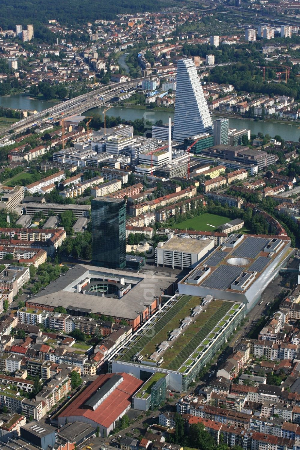 Basel from above - Extension construction sites on the premises and premises of the pharmaceutical company Roche with the cityscape-defining high-rise in Basel in Switzerland