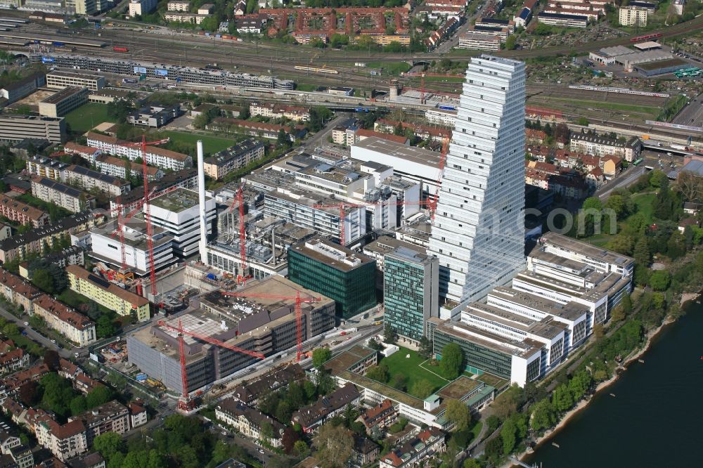 Aerial photograph Basel - Extension construction sites on the premises and premises of the pharmaceutical company Roche with the cityscape-defining high-rise in Basel in Switzerland