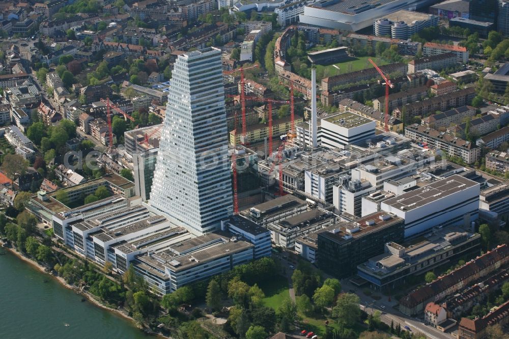 Aerial image Basel - Extension construction sites on the premises and premises of the pharmaceutical company Roche with the cityscape-defining high-rise in Basel in Switzerland