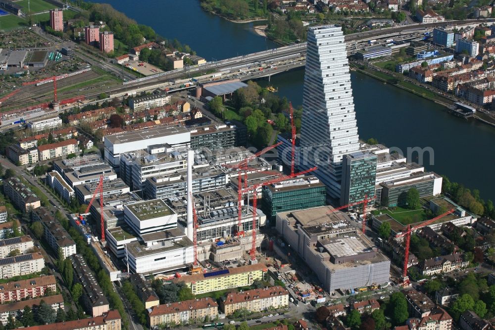 Aerial photograph Basel - Extension construction sites on the premises and premises of the pharmaceutical company Roche with the cityscape-defining high-rise in Basel in Switzerland