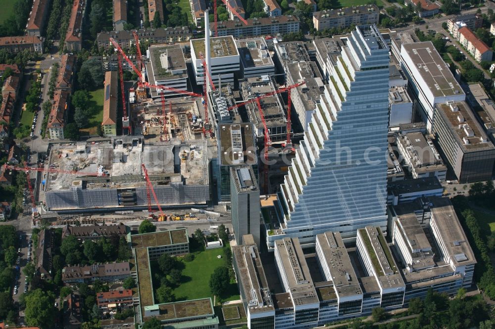 Basel from above - Extension construction sites on the premises and premises of the pharmaceutical company Roche with the cityscape-defining high-rise in Basel in Switzerland