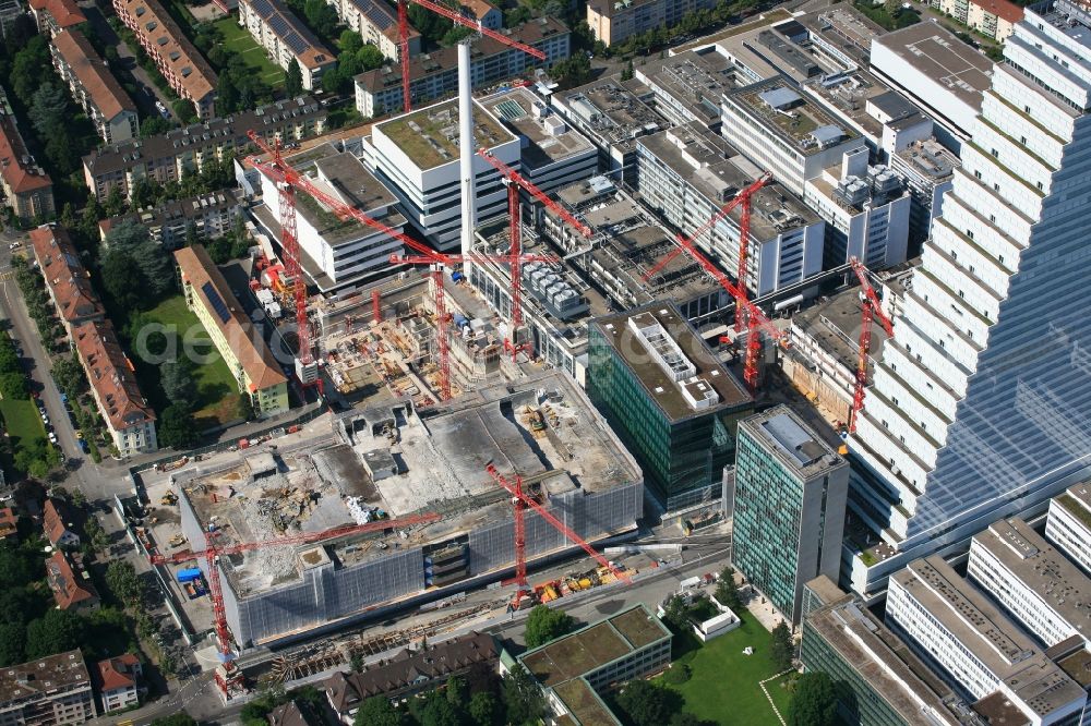 Aerial image Basel - Extension construction sites on the premises and premises of the pharmaceutical company Roche with the cityscape-defining high-rise in Basel in Switzerland