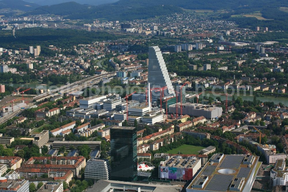 Basel from above - Extension construction sites on the premises and premises of the pharmaceutical company Roche with the cityscape-defining high-rise in Basel in Switzerland