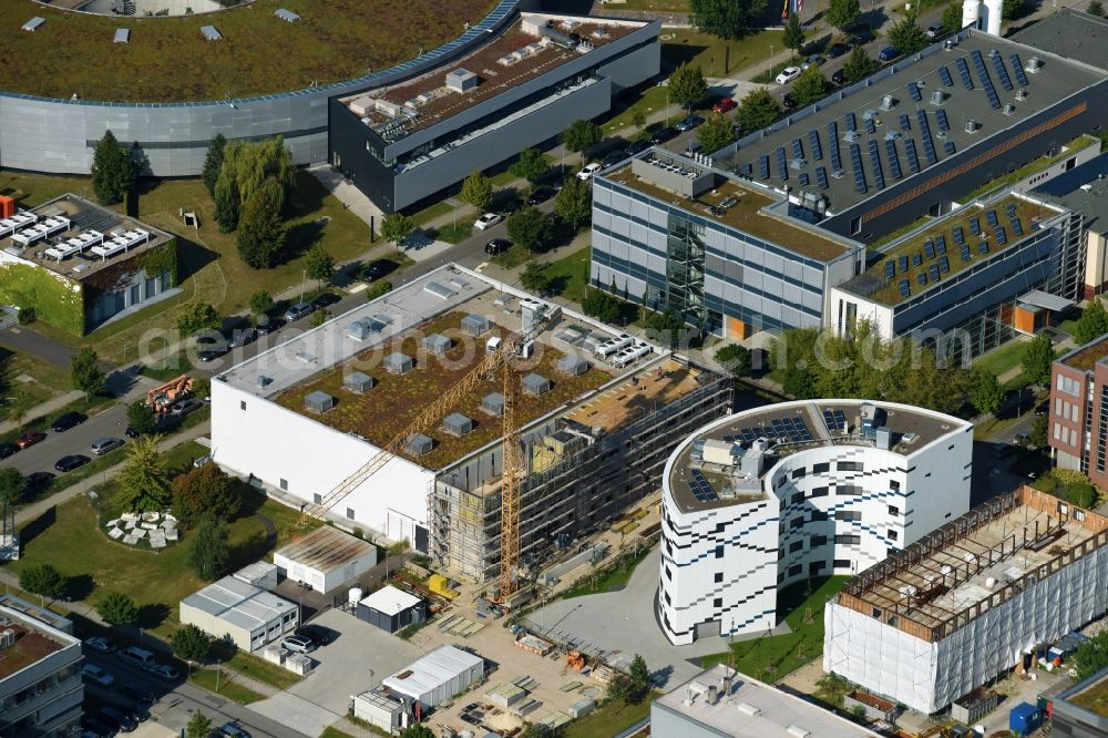 Berlin from the bird's eye view: Extension of new building site at the building complex of the institute Willy-Wien-Laboratorium (PTB) on Magnusstrasse in the district Adlershof in Berlin, Germany