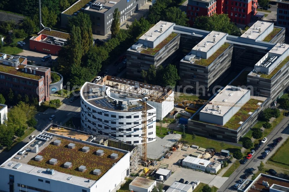 Aerial image Berlin - Extension of new building site at the building complex of the institute Willy-Wien-Laboratorium (PTB) on Magnusstrasse in the district Adlershof in Berlin, Germany