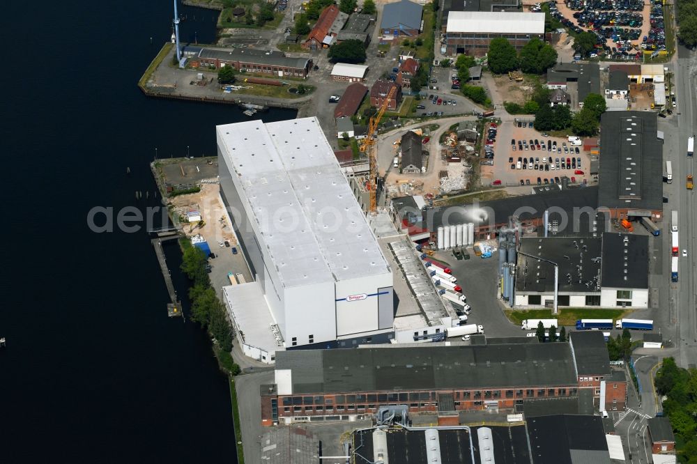 Lübeck from the bird's eye view: Extension - new building - construction site on the factory premises of H. & J. BRUeGGEN KG on Glashuettenweg in Luebeck in the state Schleswig-Holstein, Germany