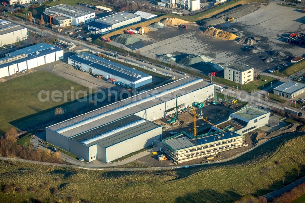 Werl from the bird's eye view: Extension - new building - construction site on the factory premises of Flachstahl Werl GmbH & Co KG on Langenwiedenweg in Werl in the state North Rhine-Westphalia, Germany