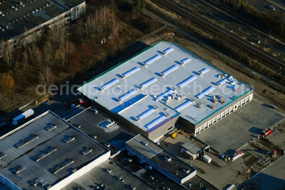 Berlin from the bird's eye view: Extension - new building - construction site on the factory premises of Harry-Brot GmbH on Wolfener Strasse in the district Marzahn in Berlin, Germany