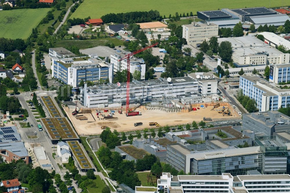 Aerial image Unterföhring - Expansion site on the building complex of the transmitter New Campus of ProSieben Sat.1 Media SE on Medienallee - Gutenbergstrasse in Unterfoehring in the state Bavaria, Germany