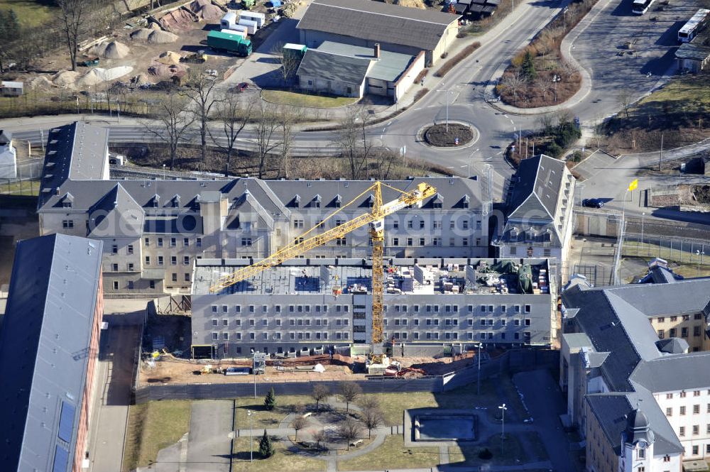 Aerial image Waldheim - Blick auf die Justizvollzugsanstalt JVA Waldheim mit dem Ersatzneubau des Hafthauses 2, einst das größte Zuchthaus Sachsens und eines der ältesten in Europa. Die Einrichtung wurde 1716 unter August dem Starken eröffnet. Im späteren Zuchthaus JVA Waldheim waren auch viele Häftlinge wegen politischer Straftaten inhaftiert, insbesondere im nationalsozialistischen Deutschen Reich als auch später in der DDR. Die Justizvollzugsanstalt dient heute der Inhaftierung männlicher Erststraftäter. The Prison Waldheim Waldheim, once the largest prison in Saxony and one of the oldest in Europe.