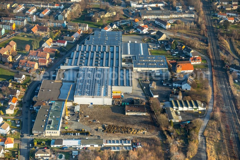 Werl from the bird's eye view: Construction site on building and production halls on the premises of Paul Neuhaus Leuchten GmbH on Olakenweg in Werl in the state North Rhine-Westphalia, Germany